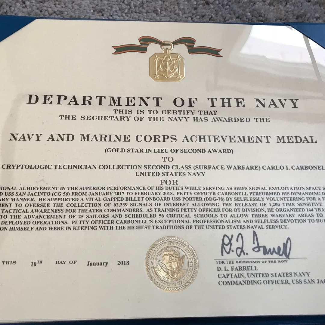 Carlo's Navy medal and award certificate